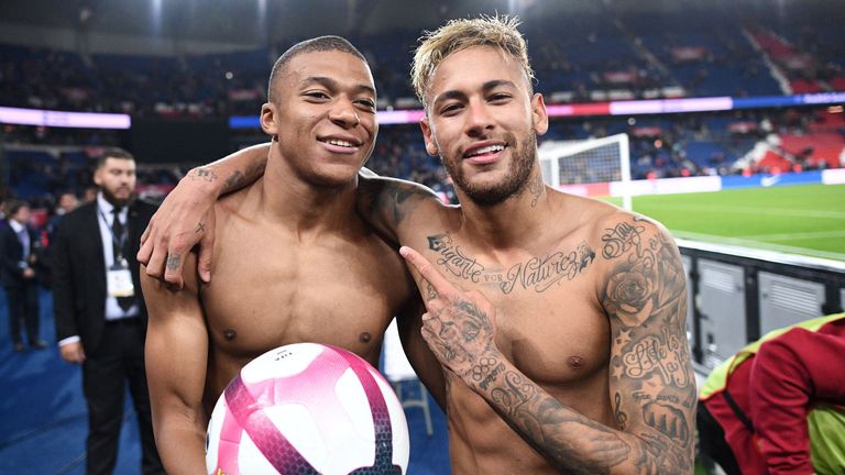 Kylian Mbappe celebrates with Neymar after scoring four against Lyon