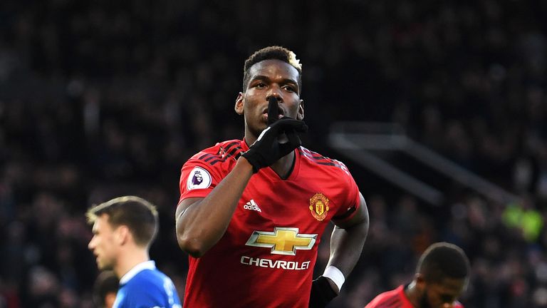Paul Pogba wheels away in celebration after scoring a rebound from a penalty against Everton