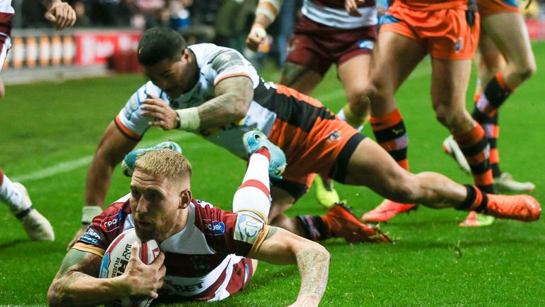 Wigan's Sam Tomkins crossing for a try