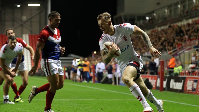 England's Tom Johnstone goes over for a try against France