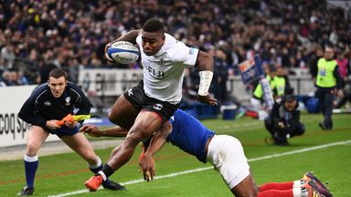 Josua Tuisova runs to score a try against France