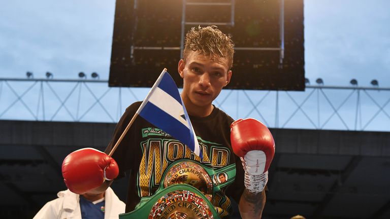 Cristofer Rosales celebrates after defeating Paddy Barnes