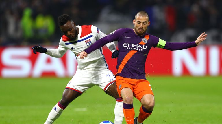   David Silva (right) tries to win the ball in the middle of the field 