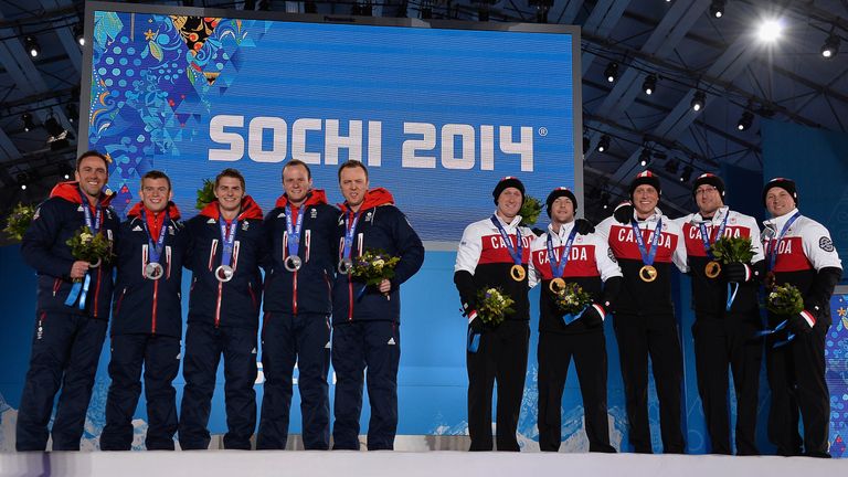 Ryan Fry (fourth from right) was part of the Canadian team that beat Great Britain to win gold in curling at Sochi 2014