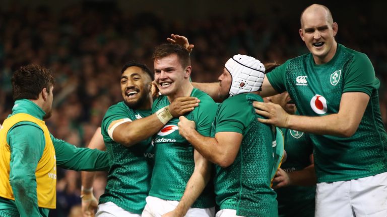 The Irish players celebrate after the Ulsterman's try 