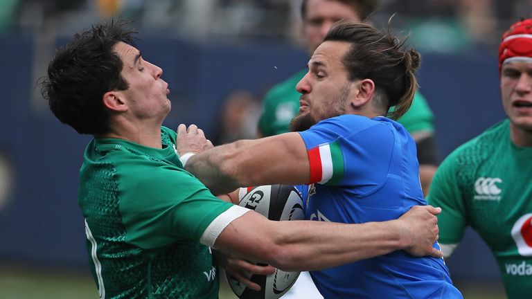 Italy's Michele Campagnaro  runs into Joey Carbery