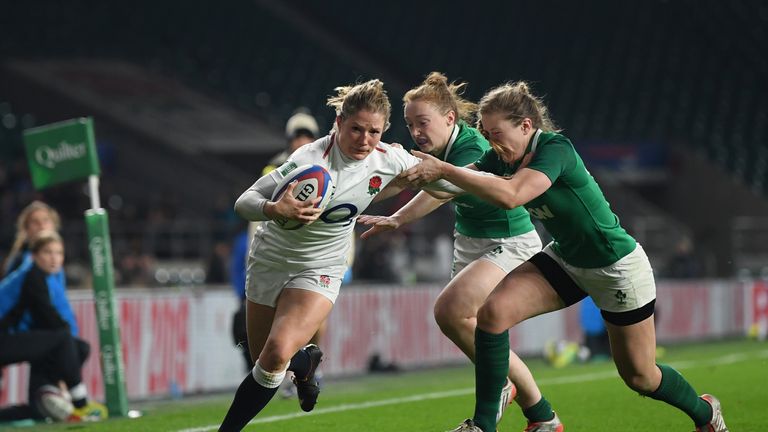 Lydia Thompson of England is tackled by Lauren Delany and Laura Sheehan of Ireland