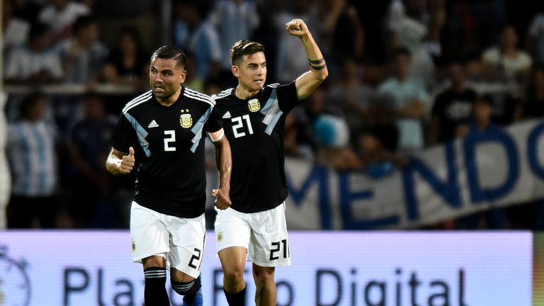 Paulo Dybala (R) celebrates scoring for Argentina