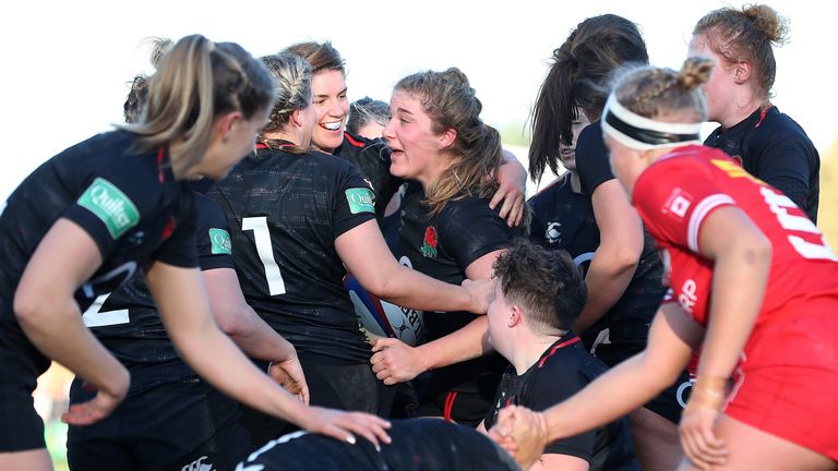 Poppy Cleall celebrates her try against Canada, 