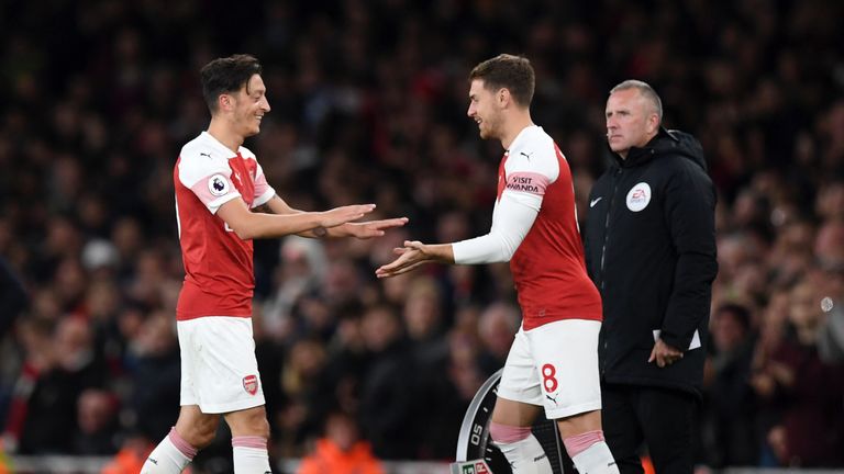 Mesut Ozil (left) is another Arsenal player whose future is unclear.