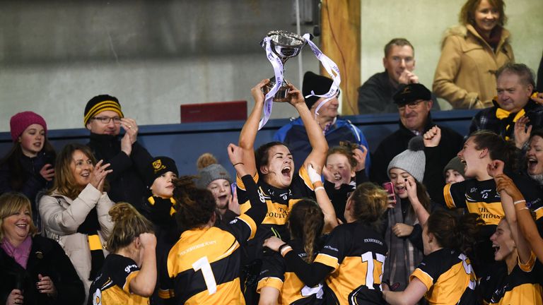 Brid O'Sullivan of Mourneabbey lifts the Dolores Tyrrell Memorial Cup