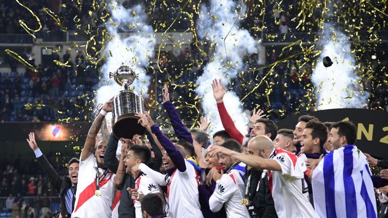 River Plate players celebrate with the trophy at the Bernabeu