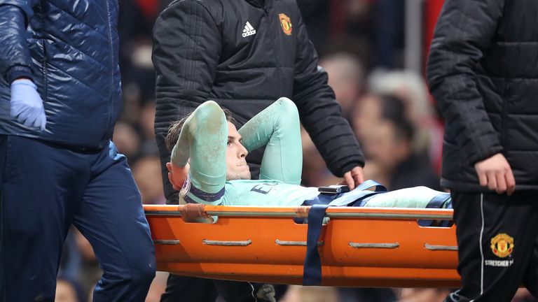Rob Holding was stretchered off at Old Trafford