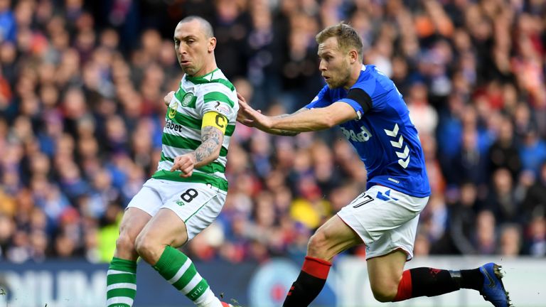 Brown clears the ball from Rangers' Scott Arfield