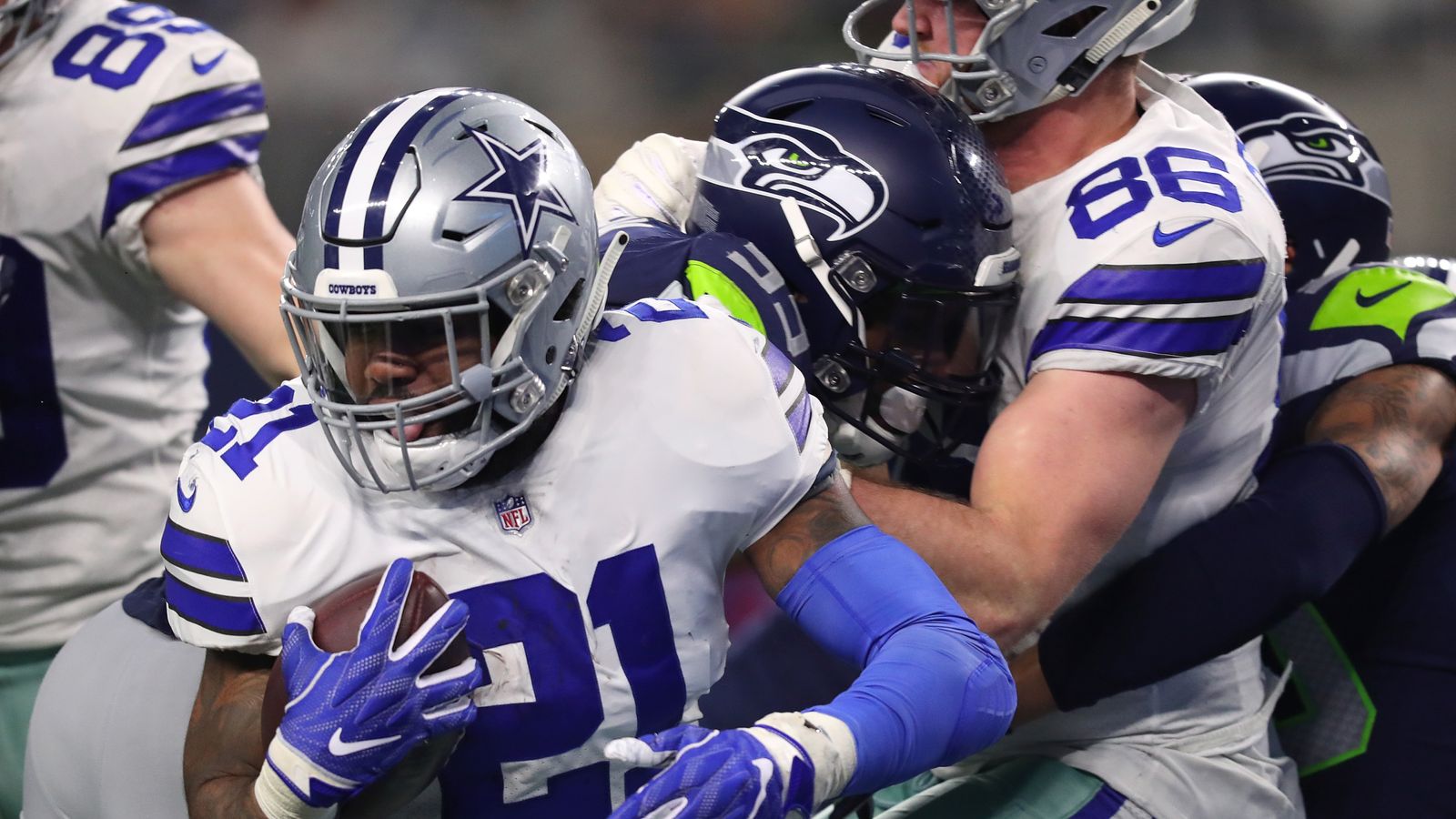 January 05, 2019: Dallas Cowboys running back Ezekiel Elliott #21 and  Seattle Seahawks running back Rashaad Penny #20 exchange jerseys after the  NFL Wildcard Playoff football game between the Seattle Seahawks and