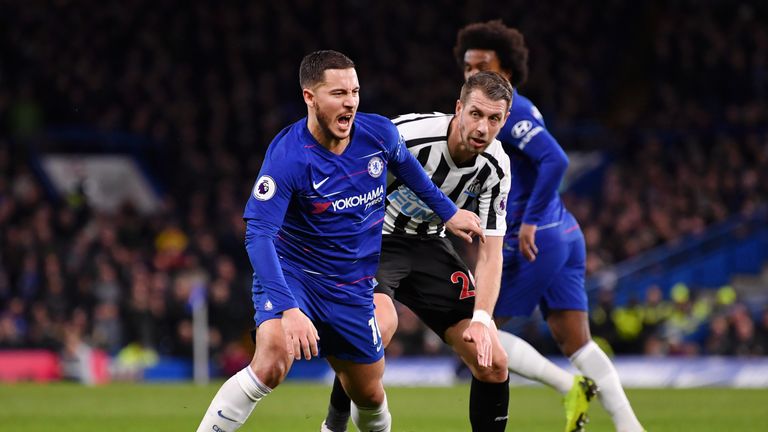 Eden Hazard is challenged by Florian Lejeune