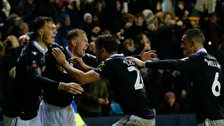 Millwall defenseman Jake Cooper (left) celebrates his second goal against Everton