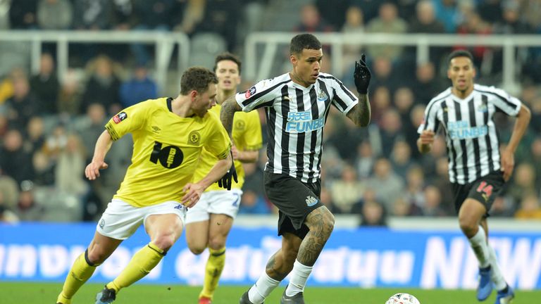 Kenedy tussles for the ball at St James' Park