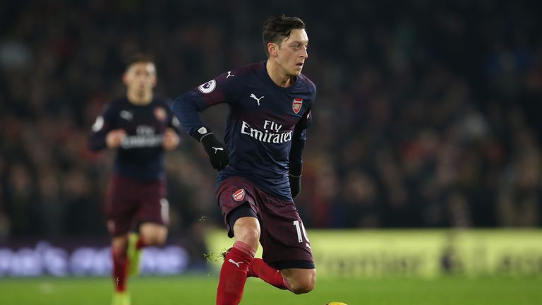 Mesut Ozil's agent says the German is 100 per cent committed to Arsenal