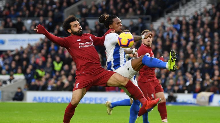 Mohamed Salah and Gaetan Bong battle for possession