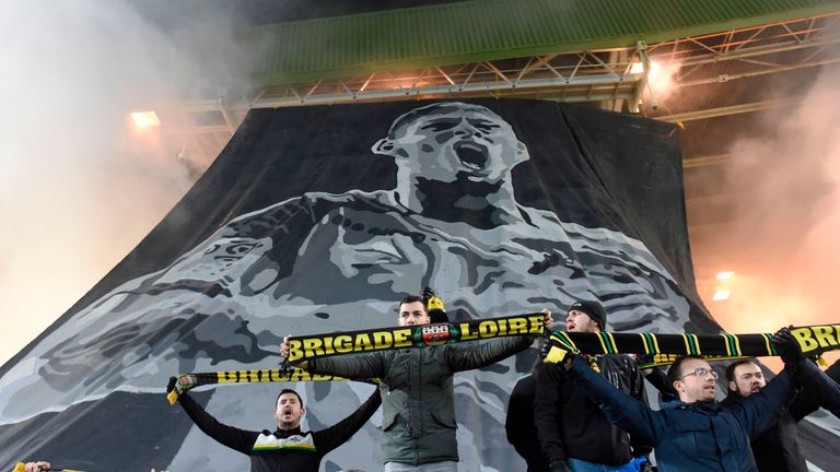 Nantes fans pay tribute to Emiliano Sala with the flag of their former striker in the club's first match after the disappearance of his plane