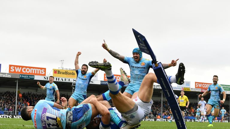 Tom O'Flaherty dives over the line after collecting Henry Slade's kick