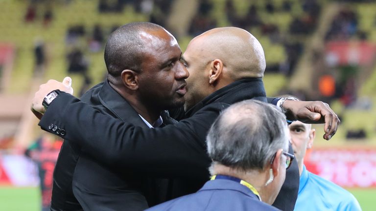 Patrick Vieira and Thierry Henry share a warm embrace before the kickoff