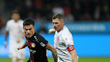 Bayer Leverkusen's Charles Aranguiz gets away from Oliver Fink 