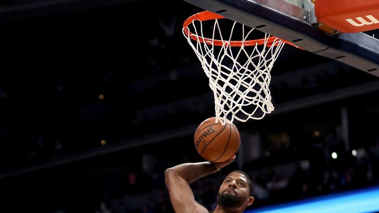 George rams home a dunk against the Denver Nuggets