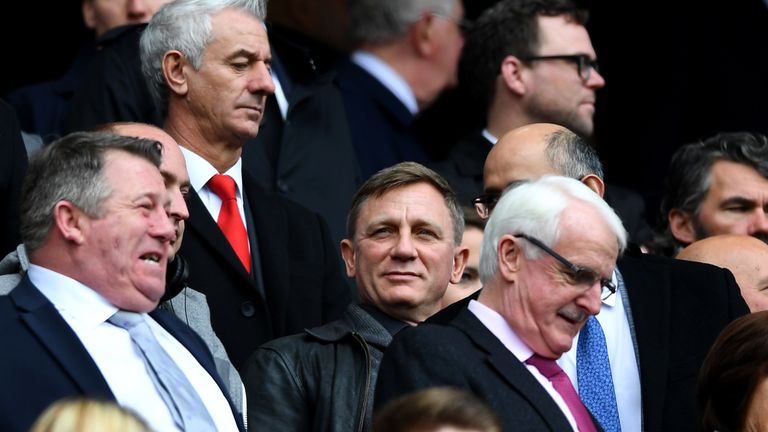 Daniel Craig, in the center, often attended Anfield