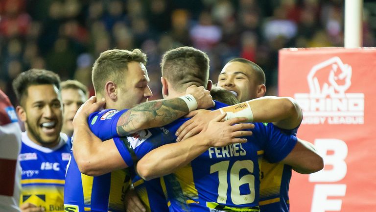 Leeds celebrate Brett Ferres' try against Wigan during an open first half