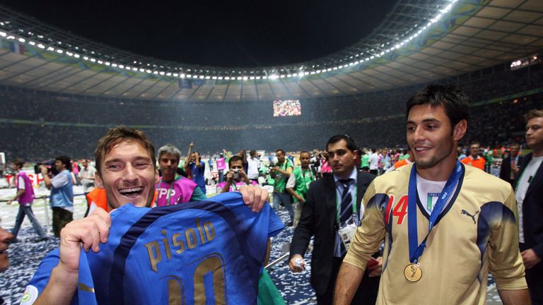 Amelia celebrates Italy's 2006 World Cup win with Francesco Totti