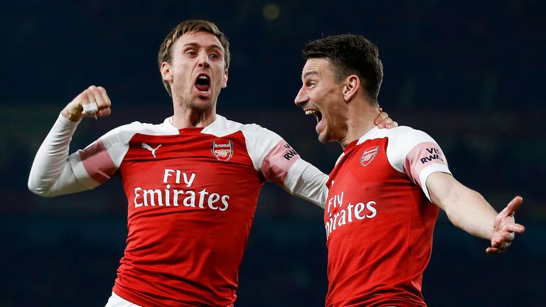 Laurent Koscielny celebrates scoring Arsenal's third goal with Nacho Monreal