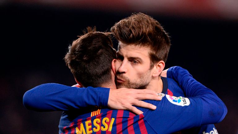Lionel Messi (L) with Barcelona team-mate and Kosmos president Gerard Pique