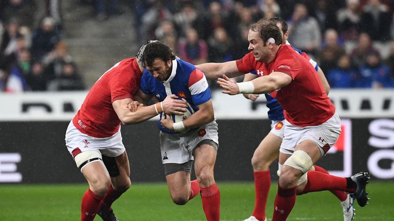Maxime Medard is tackled by Wales defenders
