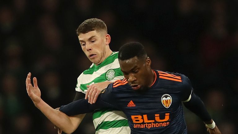 Ryan Christie of Celtic battles for possession with Geoffrey Kondogbia