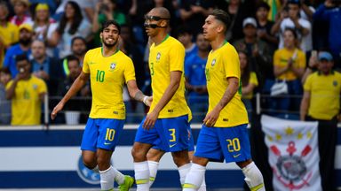 Brazil's players, including Liverpool forward Roberto Firmino (right), celebrate the opening goal in Porto