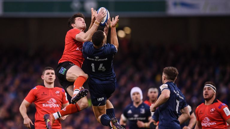 Byrne and Jacob Stockdale of Ulster compete for the ball