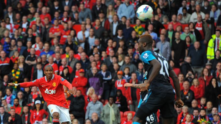 Ashley Young curls in Manchester United's eighth goal in their 8-2 thrashing of Arsenal