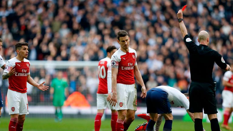 Torreira is sent off by referee Anthony Taylor after his challenge on Danny Rose 