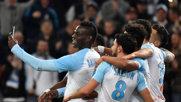 Balotelli celebrates a goal with team-mates