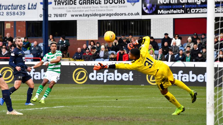 Sinclair sees his shot saved by Dundee goalkeeper Seny Dieng in the first half