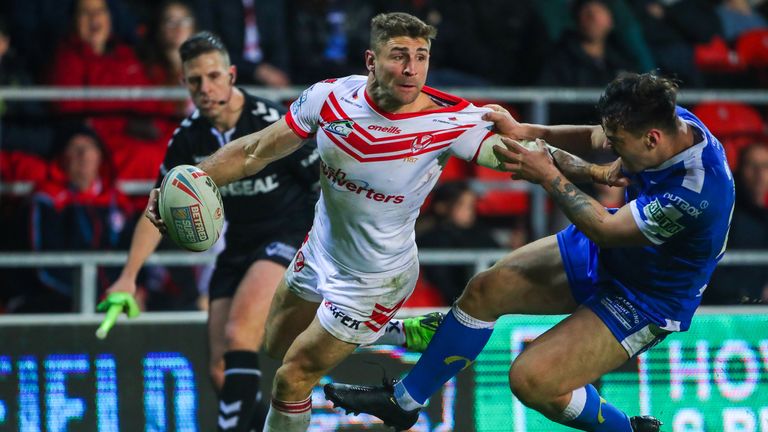 St Helens' Tommy Makinson is tackled by Hull KR's Will Oakes