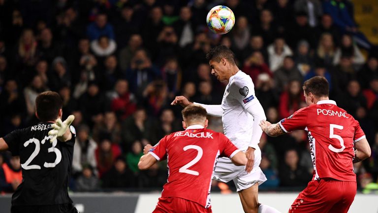Raphael Varane heads in France's second from Griezmann's near-post corner