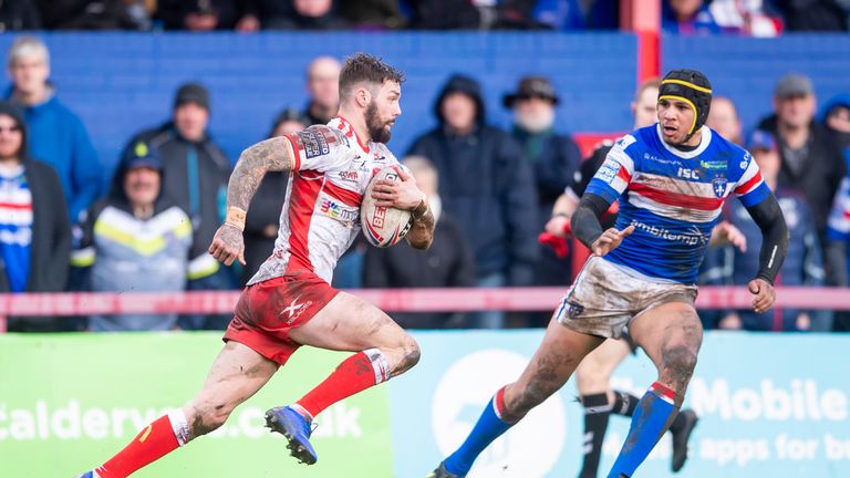 Hull KR's Will Dagger approaches Wakefield's Ben Jones-Bishop.