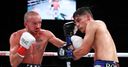 Roman defeats Doheny to unify