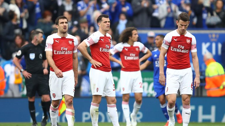 Arsenal players look dejected during their 3-0 defeat to Leicester
