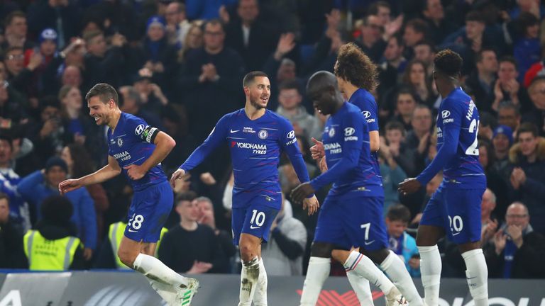 Hazard celebrates with team-mates after scoring his superb solo goal