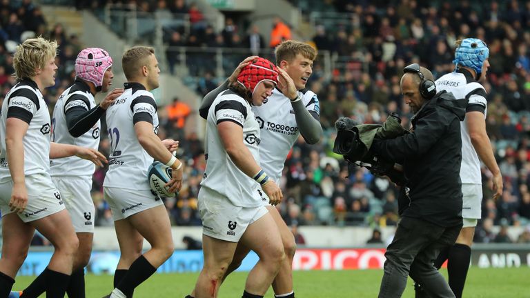 Harry Thacker is congratulated by his teammates after scoring the vital try