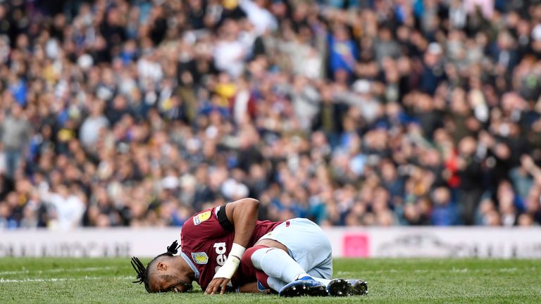 Jonathan Kodjia lay on the ground injured as Leeds controversially played on